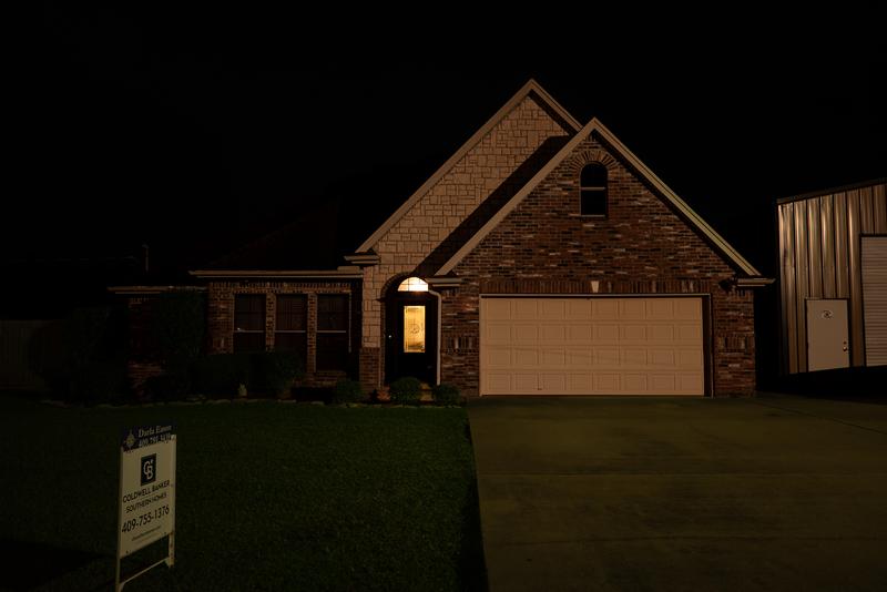 Front exterior at night with permanent holiday lights off