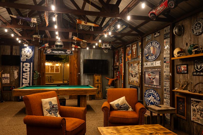 Mancave interior with pool table and sports memorabilia