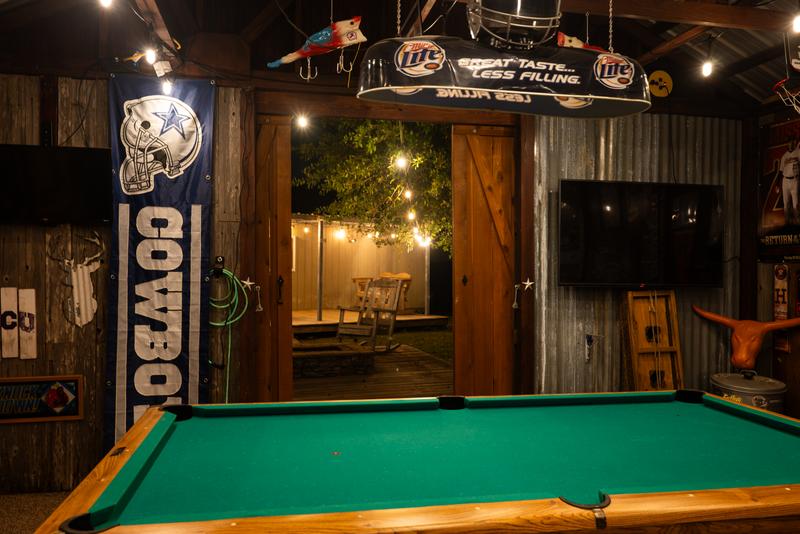 Mancave pool table looking out to backyard