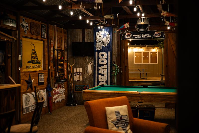 Mancave wide view with pool table and seating